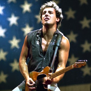 Rock star Bruce Springsteen accompanies himself on the guitar while singing the hit song "Born in the U.S.A." as he completed his world tour at Los Angeles Memorial Coliseum in late September 1985. (AP Photo/Lennox McLendon)